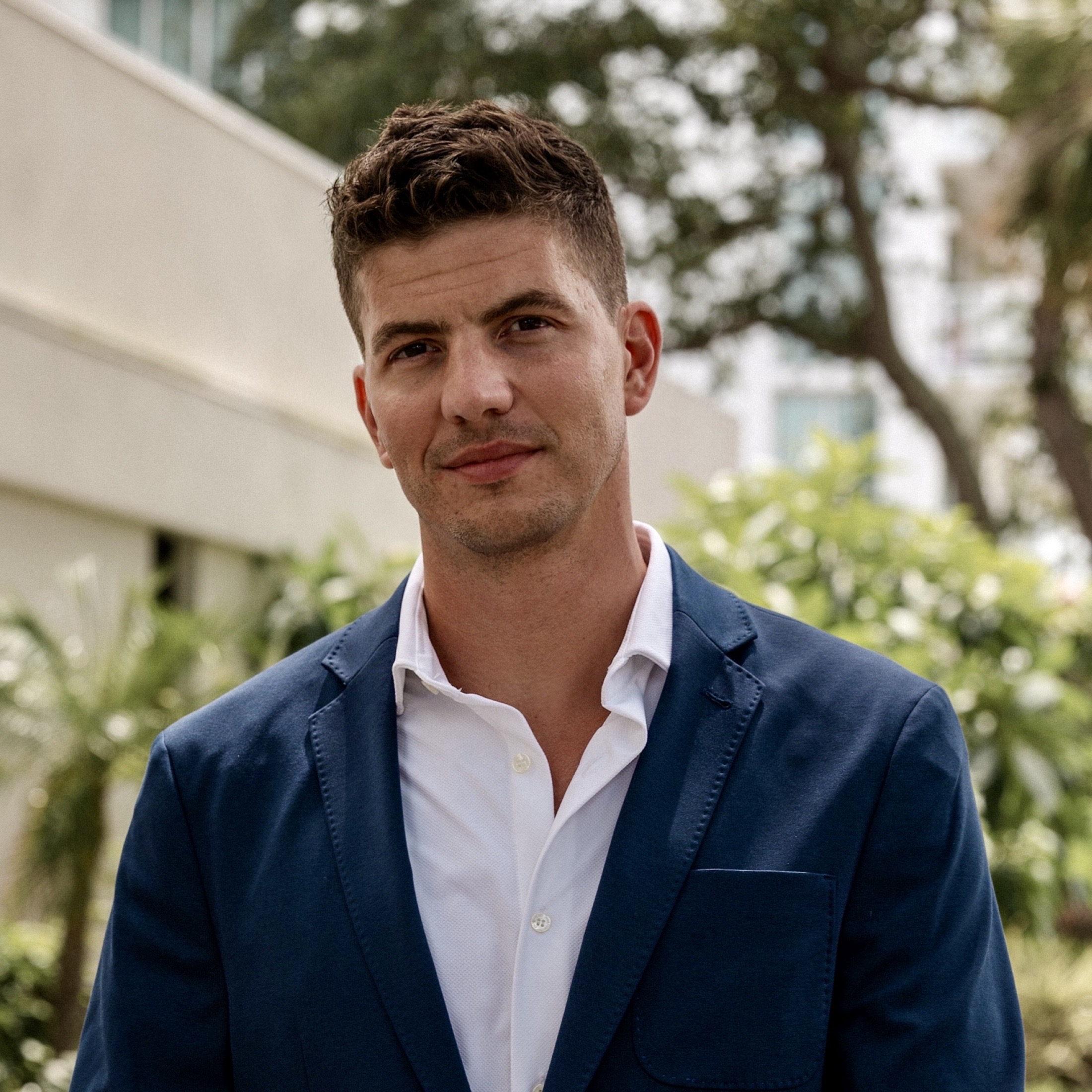 Christopher in a suit at an evening event